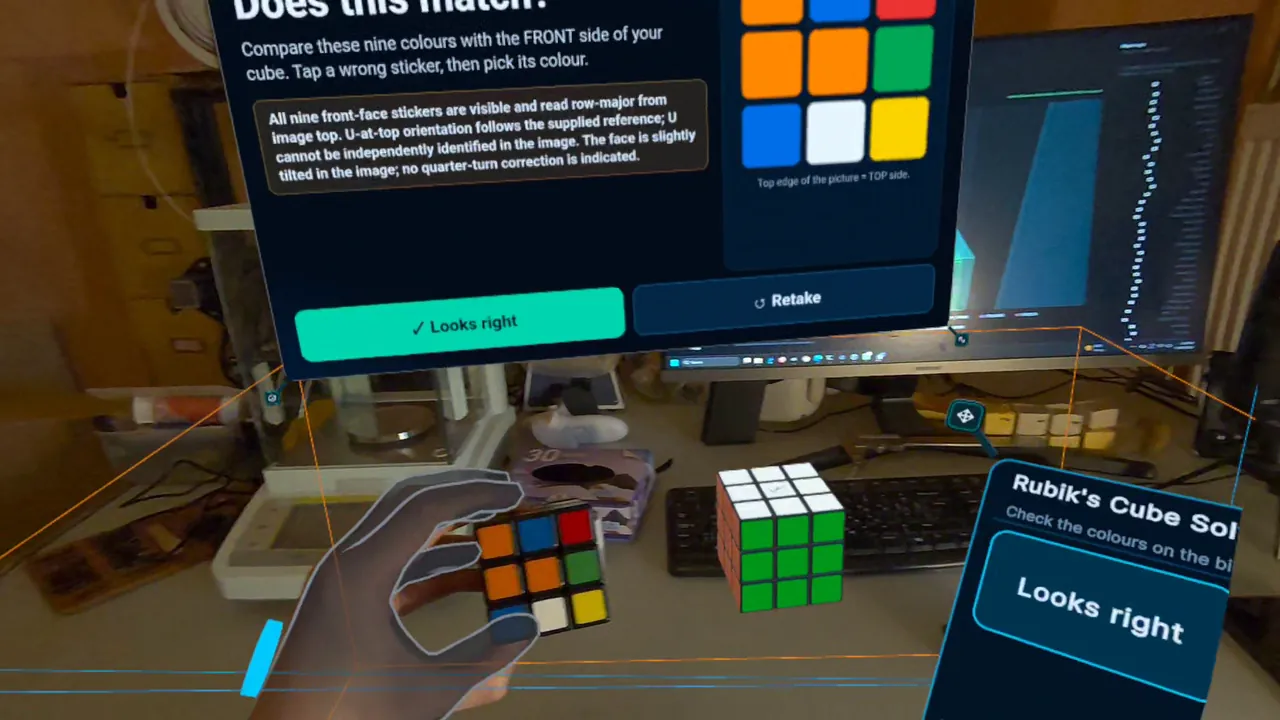 Headset view: a panel asking “Does this match?” beside the nine colours read from a photo of the cube held in a hand